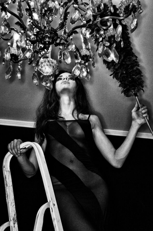 Woman dusting chandelier, Rome, 2011